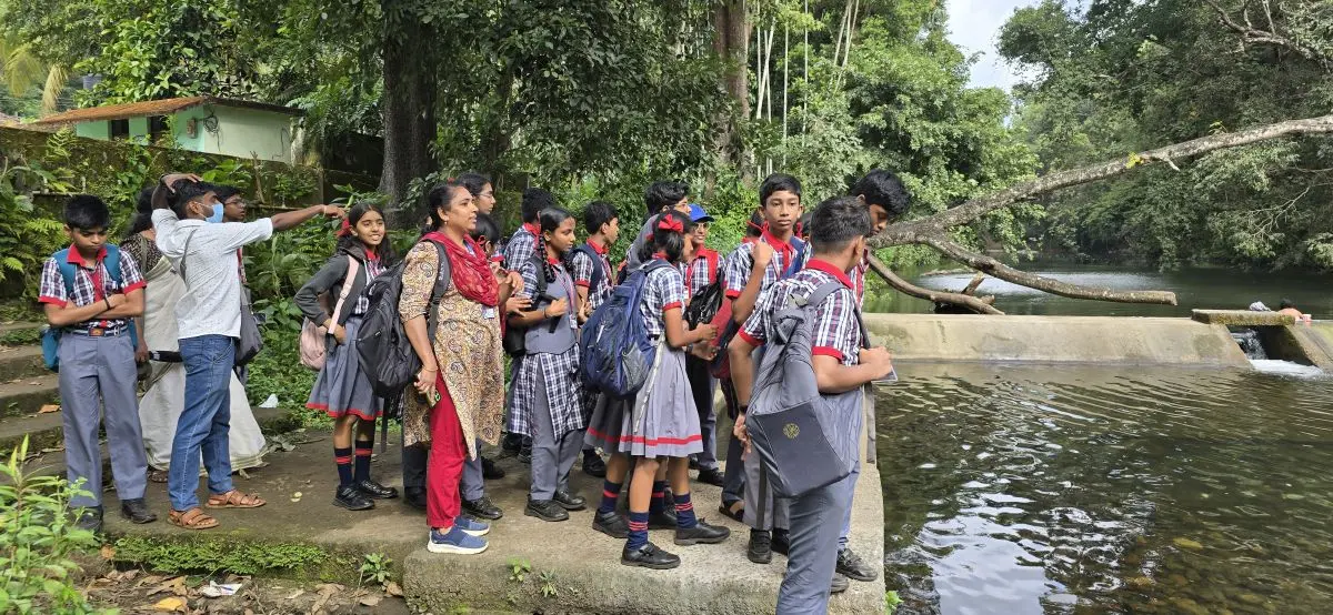School visits, student interactions, and book donations in the Attapady region. - At Bhavani River