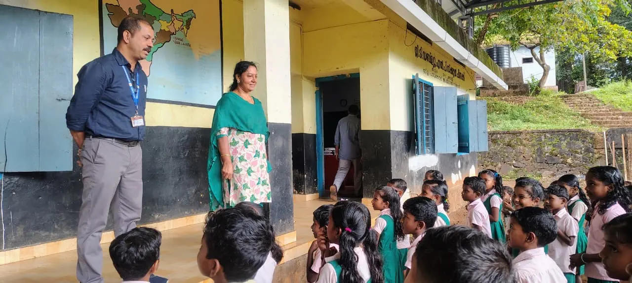 School visits, student interactions, and book donations in the Attapady region. - Interacting with Students of GLPS Chindakki